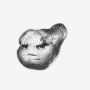 Pareidolia. AI finds faces on grains of sand